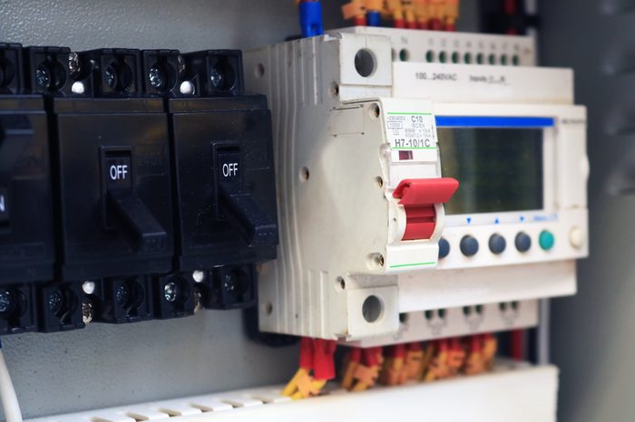 Circuit breakers red switch installed in the steel main distribution board and breaker turn off.