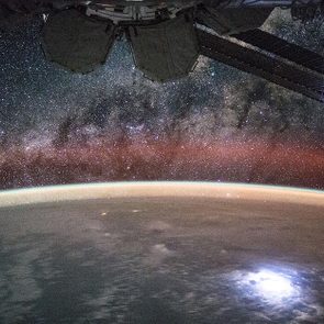 View (part of a time lapse sequence) of stars in the Milky Way Galaxy visible over an Earth limb as seen by the Expedition 44 crew. Astronaut Kjell Lindgren captured a lightning strike from space so bright that it lights up the space station’s solar panels. He posted this on Twitter and Instagram on Sept. 2 saying 