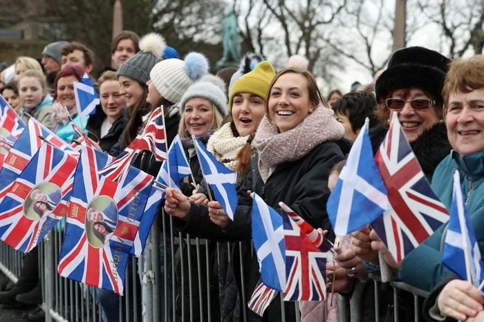 Crowds gather ahead of a visit by Prince Harry and Meghan Markle to Edinburgh Castle.
