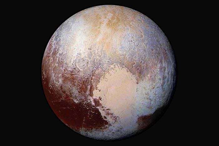 Four images from New Horizons Long Range Reconnaissance Imager LORRI were combined with color data from the spacecraft Ralph instrument to create this enhanced color global view of Pluto.