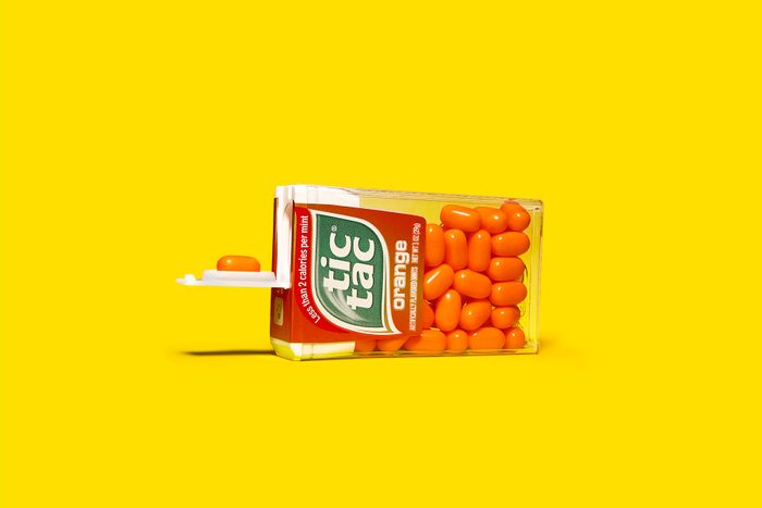 tic tac package on its side with one tic tac resting in the indentation on the interior of the serving flap