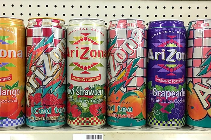 Alameda, CA - October 27, 2017: Grocery store shelf with cans of Arizona brand teas, various flavors. Arizona is known for its Big Can drinks holding 23oz fl. oz of iced teas