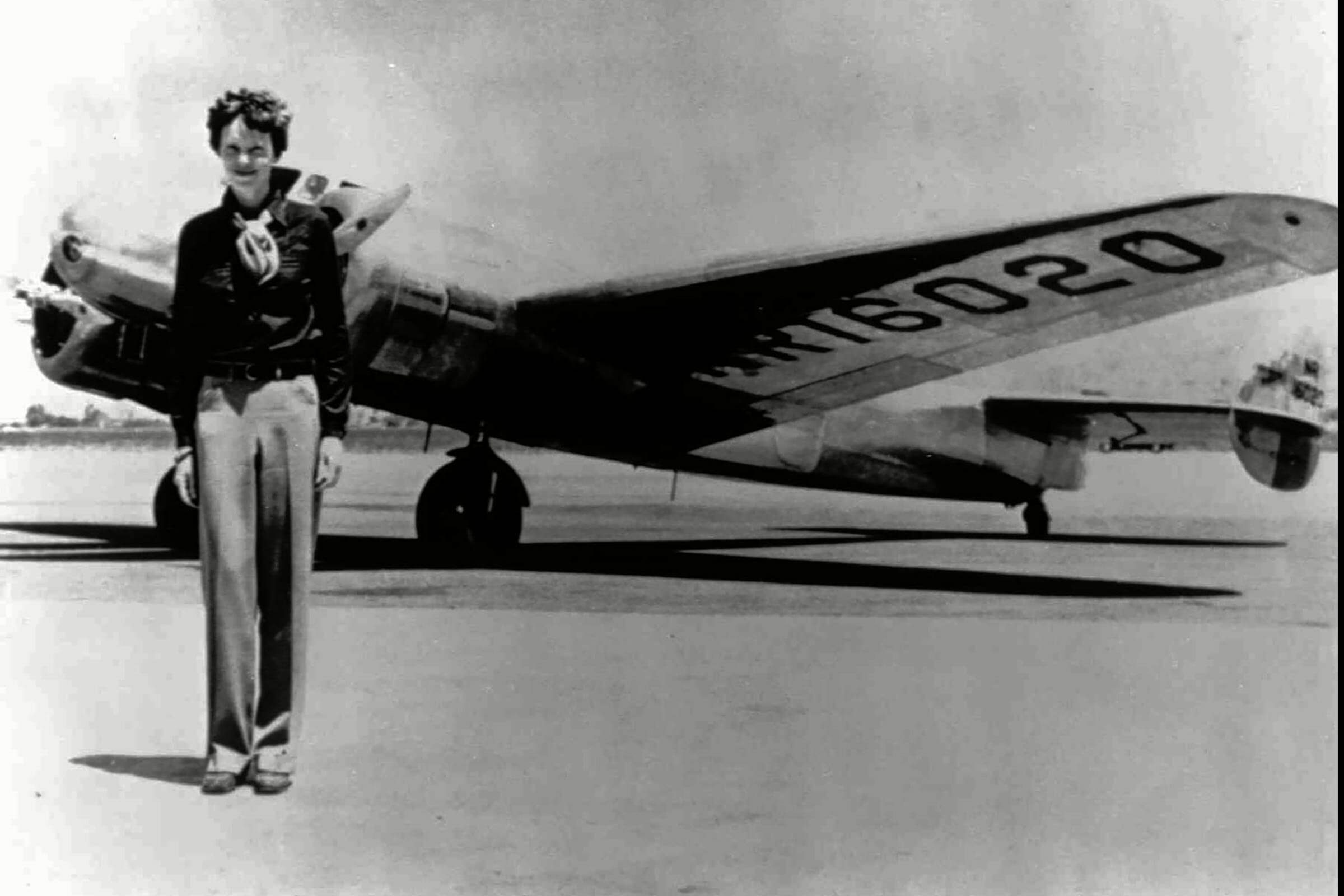 EARHART Amelia Earhart, 40, stands next to a Lockheed Electra 10E, before her last flight in 1937 from Oakland, Calif., bound for Honolulu on the first leg of her record-setting attempt to circumnavigate the world westward along the Equator