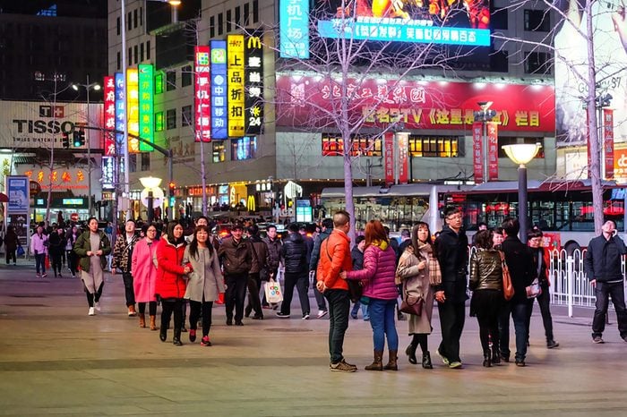 Beijing, China - 5 March 2016 : Unidentified people enjoy walking and sightseeing at Wangfujing Street. Wangfujing Street is one of the most famous shopping streets in China as a paradise for shoppers