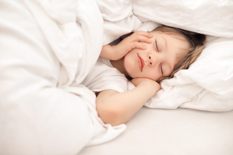 Child sleeping in bed
