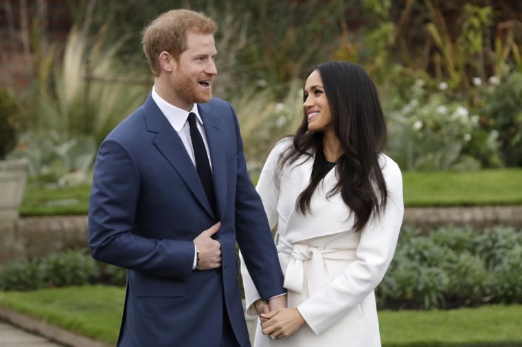 Dated, Britain's Prince Harry and his fiancee Meghan Markle pose for photographers in the grounds of Kensington Palace in London, following the announcement of their engagement. Speculation is mounting over who will be invited to the May 19, 2018, royal wedding of Prince Harry and Meghan Markle, with pundits guessing about the wedding guest list