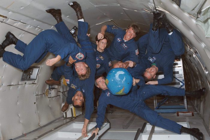 The crew of STS-45 is already training for its March 1992 mission, including stints on the KC-135 zero-gravity-simulating aircraft. Shown with an inflatable globe are, clockwise from the top, C. Michael Foale, mission specialist; Dirk Frimout, payload specialist; Brian Duffy, pilot; Charles R. (Rick) Chappell, backup payload specialist; Charles F. Bolden, mission commander; Byron K. Lichtenberg, payload specialist; and Kathryn D. Sullivan, payload commander.