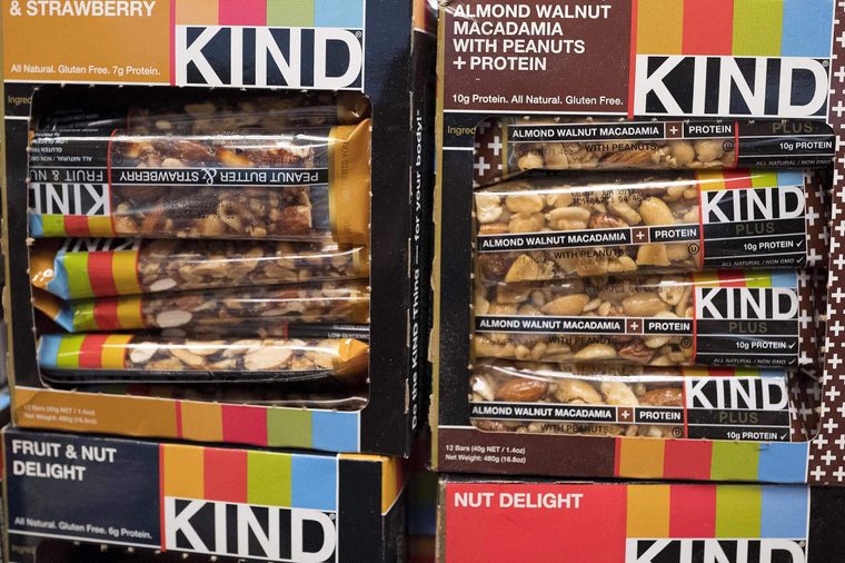Kind snack bars are displayed in a New York supermarket, . Kind CEO Daniel Lubetzky is pledging $25 million over the next 10 years to create a nonprofit dedicated to "revealing and countering" the food industry's influence on public health. The move underscores the division between "Big Food" companies and newer players that market themselves as wholesome alternatives aligned with public health