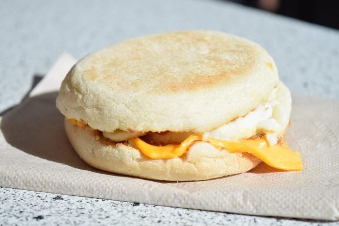 breakfast english muffin sandwich on paper napkin
