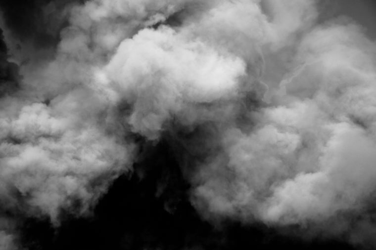 Fluffy Puffs of Smoke and Fog on Black Background.Cloud for use background. Artistic abstraction composed of nebulous.