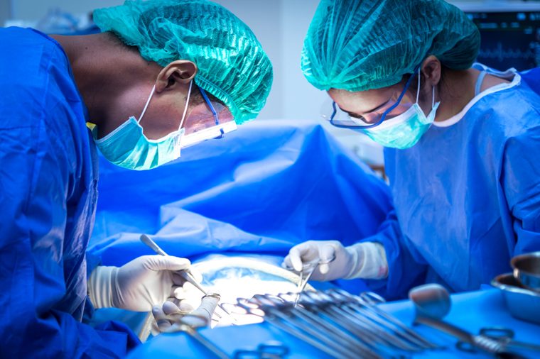 Surgical team performing surgery operation. Doctor performing surgery .
