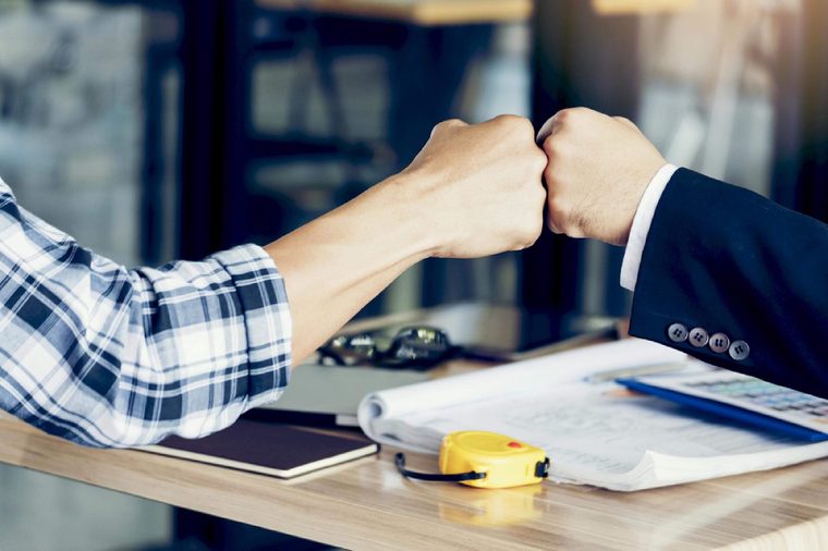 Success Business Partners Giving Fist Bump after Complete a Deal. Successful Teamwork with Hands Gesture Communication. Businessman with Team Agreement in Corporate. Partnership Business Concept