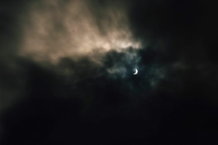 Dark dramatic sky during solar eclipse