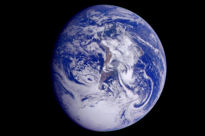 This color image of the Earth was obtained by NASA's Galileo at about 6:10 a.m. Pacific Standard Time on Dec. 11, 1990, when the spacecraft was about 1.3 million miles from the planet during the first of two Earth flybys on its way to Jupiter. The color composite used images taken through the red, green and violet filters. South America is near the center of the picture, and the white, sunlit continent of Antarctica is below. Picturesque weather fronts are visible in the South Atlantic, lower right. This is the first frame of the Galileo Earth spin movie, a 500- frame time-lapse motion picture showing a 25-hour period of Earth's rotation and atmospheric dynamics.