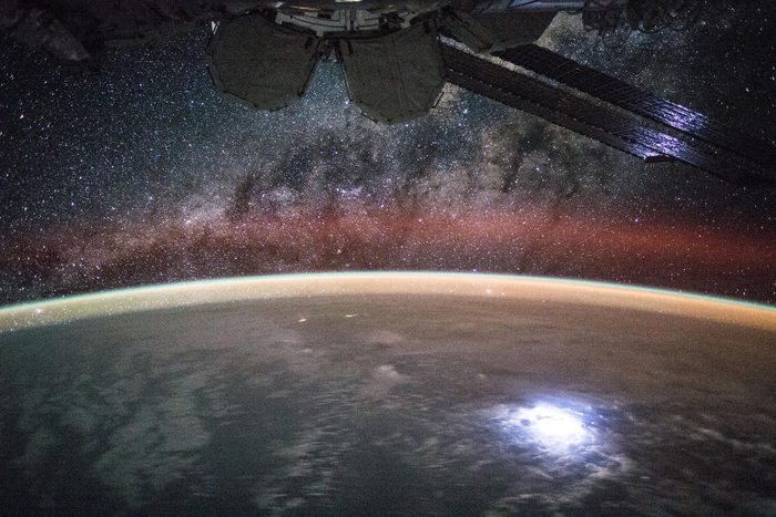 View (part of a time lapse sequence) of stars in the Milky Way Galaxy visible over an Earth limb as seen by the Expedition 44 crew. Astronaut Kjell Lindgren captured a lightning strike from space so bright that it lights up the space station’s solar panels. He posted this on Twitter and Instagram on Sept. 2 saying "Large lightning strike on Earth lights up or solar panels."