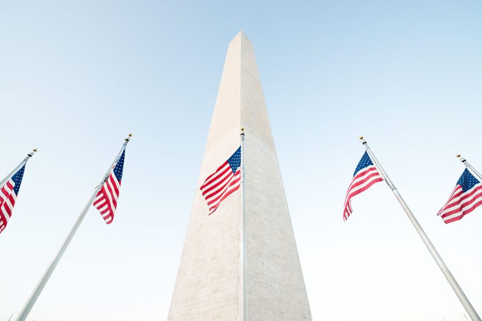 washington monument with american flags