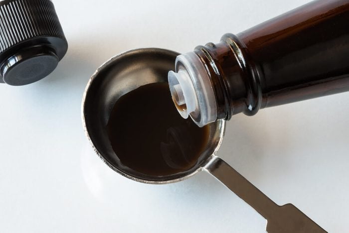 Pouring Worcestershire Sauce in tablespoon