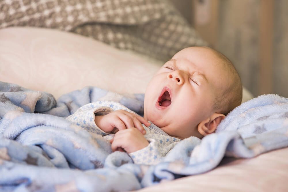 Cute baby yawning before sleep