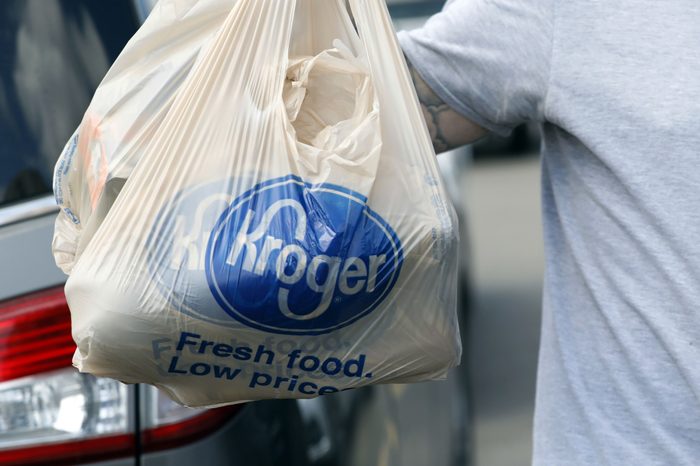 A shopper removes grocery store bags from their shopping cart at a Kroger store in Flowood, Miss. The Kroger Co. reports earnings Thursday, Nov. 30, 2017