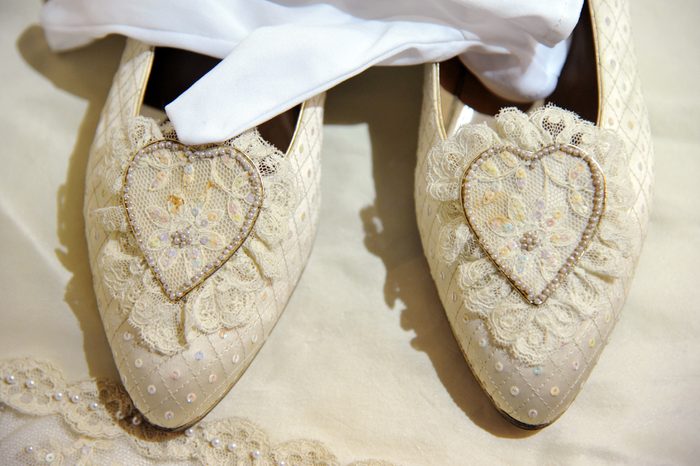 A pair of duplicate wedding shoes fitted to and worn by Princess Diana, 1981, Estimated sale value GBP50-70,000.