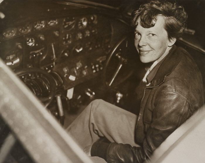 Amelia Earhart sitting in the cockpit of her Lockheed Electra airplane, ca. 1936. In July 1937 Earhart and the airplane were lost over the Pacific Ocean.