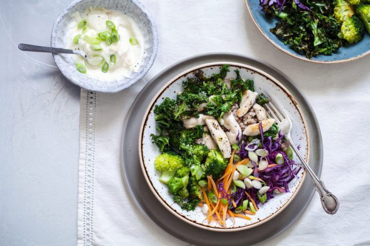 Healthy salad with buckwheat, chicken, broccoli, crispy kale and red cabbage