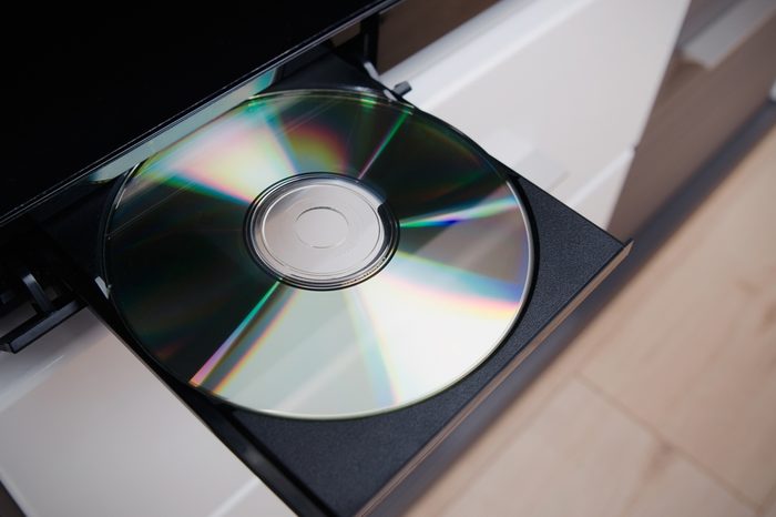 Close up of CD or DVD player with inserted disc