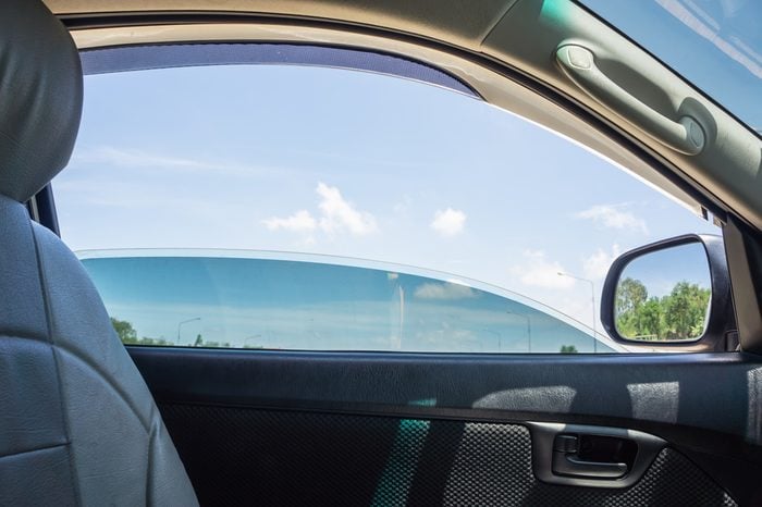 The door car open window glass with blue sky view.