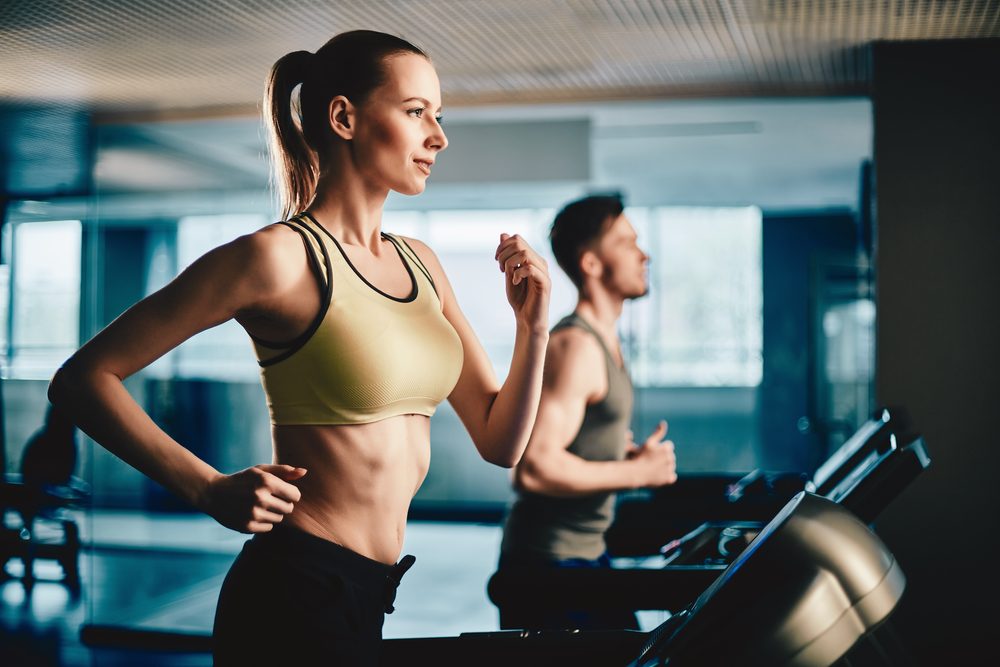 Fitness, sport, training, gym and lifestyle concept. Group of smiling people  exercising in the gym Stock Photo by nd3000