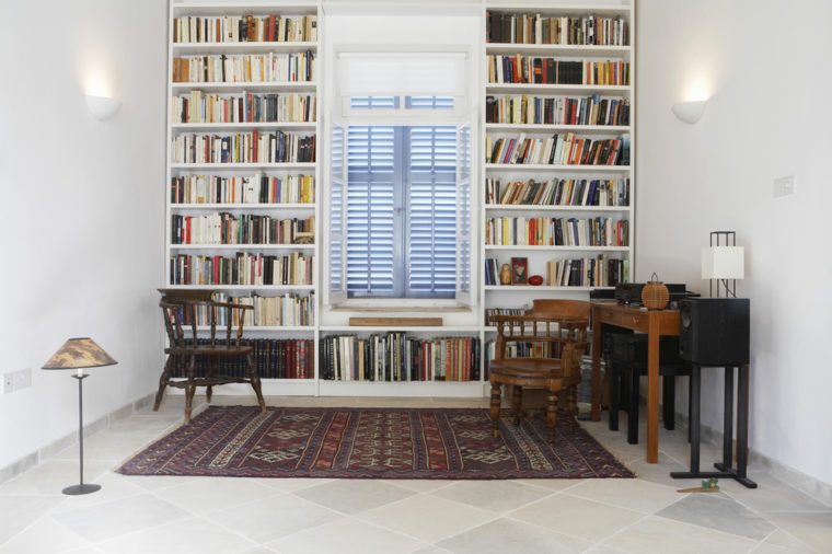 Interior of town house with books arranged in library