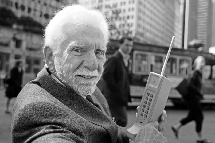 COOPER Martin Cooper, chairman and CEO of ArrayComm, holds a Motorola DynaTAC, a 1973 prototype of the first handheld cellular telephone on Market Street in San Francisco, . 30 years ago the first call was made from a handheld cellular telephone