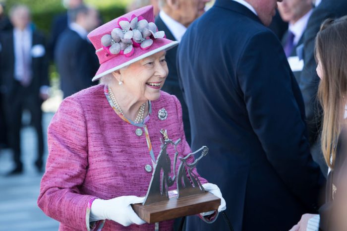 Queen Elizabeth II receives a Kelpies sculpture as a gift on a visit to the Kelpies to open the Queen Elizabeth II Canal at the Helix Park, Falkirk.