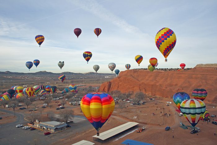 Mass hot air balloon ascension at the annual Red Rocks Balloon Festival at the Red Rocks State Park near Gallup, New Mexico.