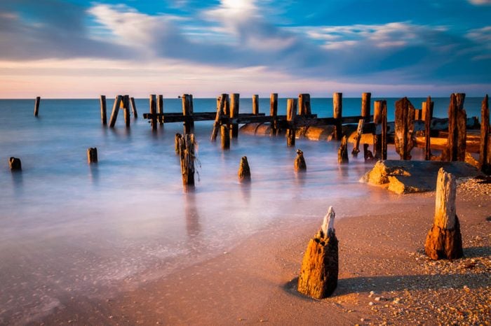 Long exposure at sunset of pier pilings in the Delaware Bay at Sunset Beach, Cape May, New Jersey.
