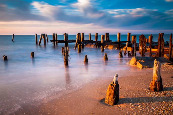 Long exposure at sunset of pier pilings in the Delaware Bay at Sunset Beach, Cape May, New Jersey.
