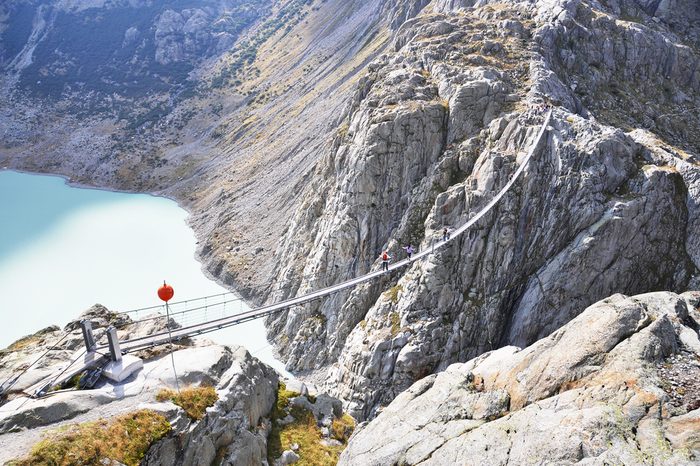 Trift Bridge, the longest 170m pedestrian-only suspension bridge in the Alps. Switzerland