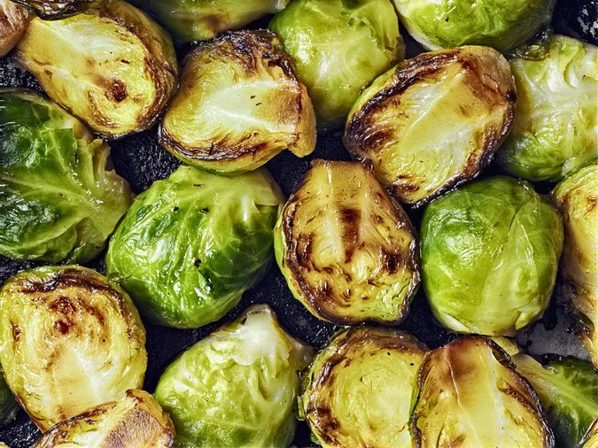 close up of rustic crispy fried brussels sprouts food background