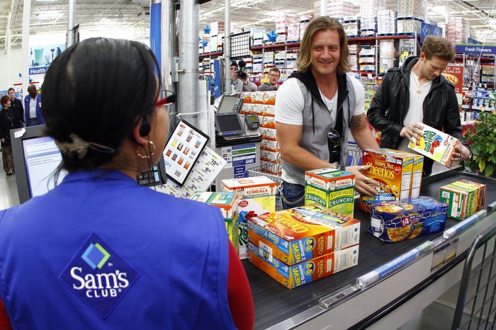 Florida Georgia Line's Tyler Hubbard, center, and Brian Kelley check out at Sam's Club in support of Outnumber Hunger, in Nashville, Tenn