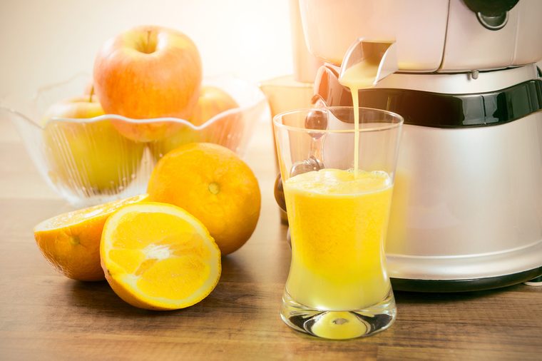 Juicer prepares fresh and healthy juice. juicer juice extractor fresh blender machine concept