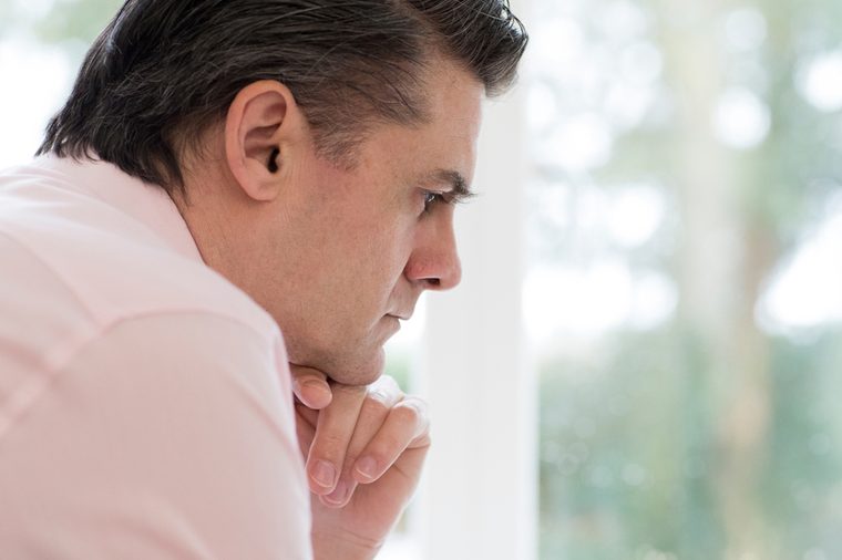Profile View Of Worried Mature Man At Home