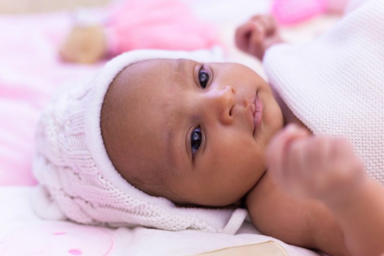 Adorable little african american baby girl looking - Black people