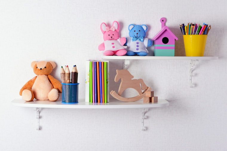 Shelves with toys in child room close-up