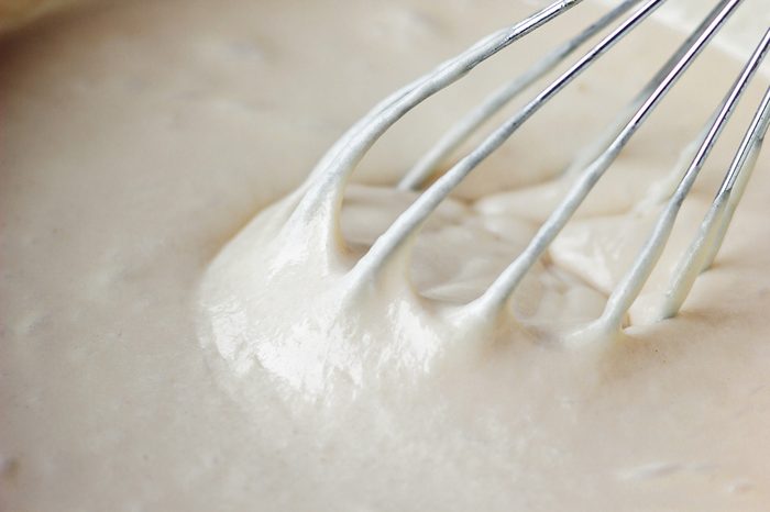 Mixing Batter or dough for banana cake or muffin or pancake. Close up, soft focus.
