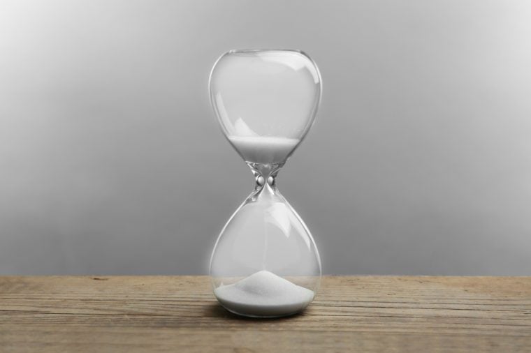Hourglass on grey background