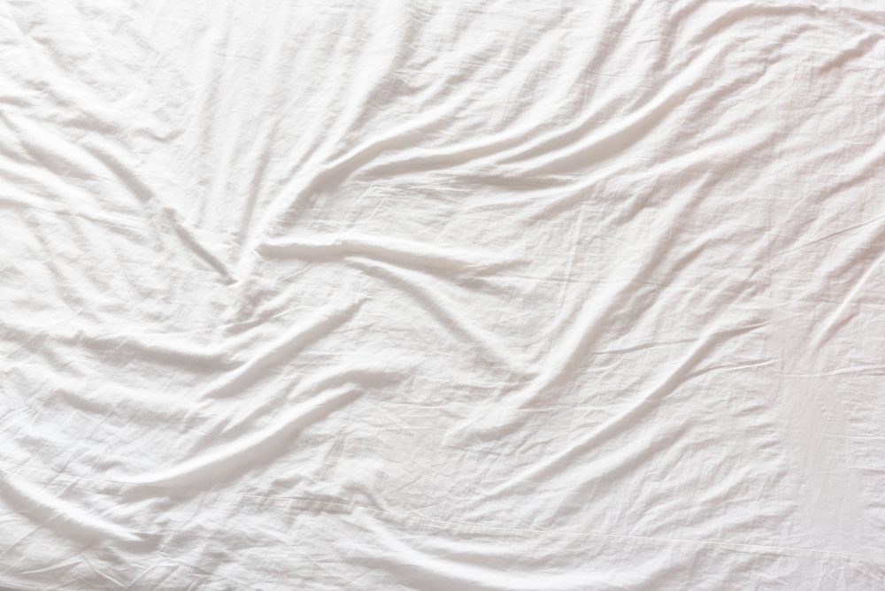 wrinkled sheets on bed