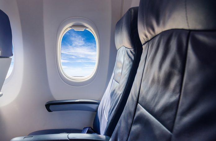 empty seat airplane and window view inside an aircraft 