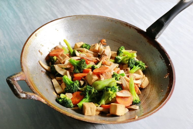 Stir the vegetables in the pan ,stir fried vegetables in a chinese wok