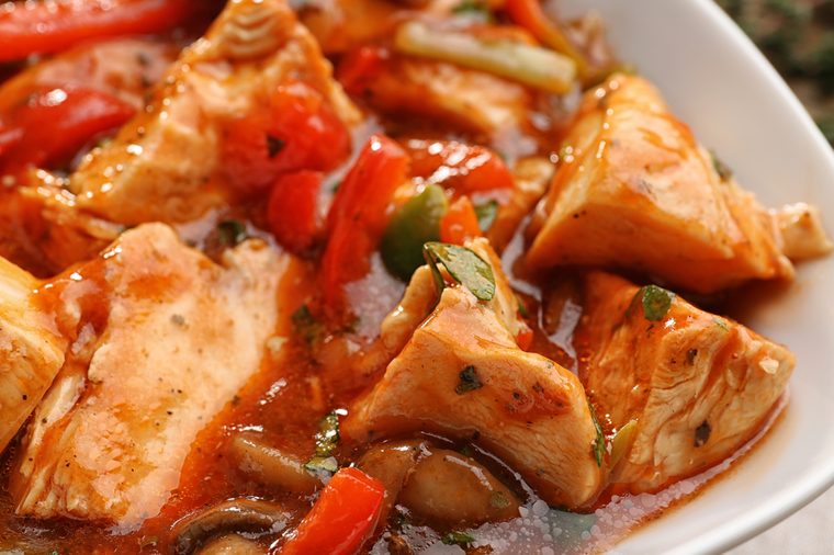 Plate with tasty chicken cacciatore, closeup