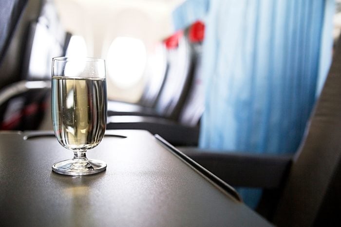 photo of glass of wine in the plane