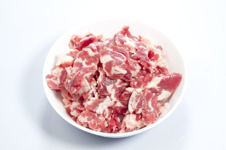 Pieces of slice raw meat on white background